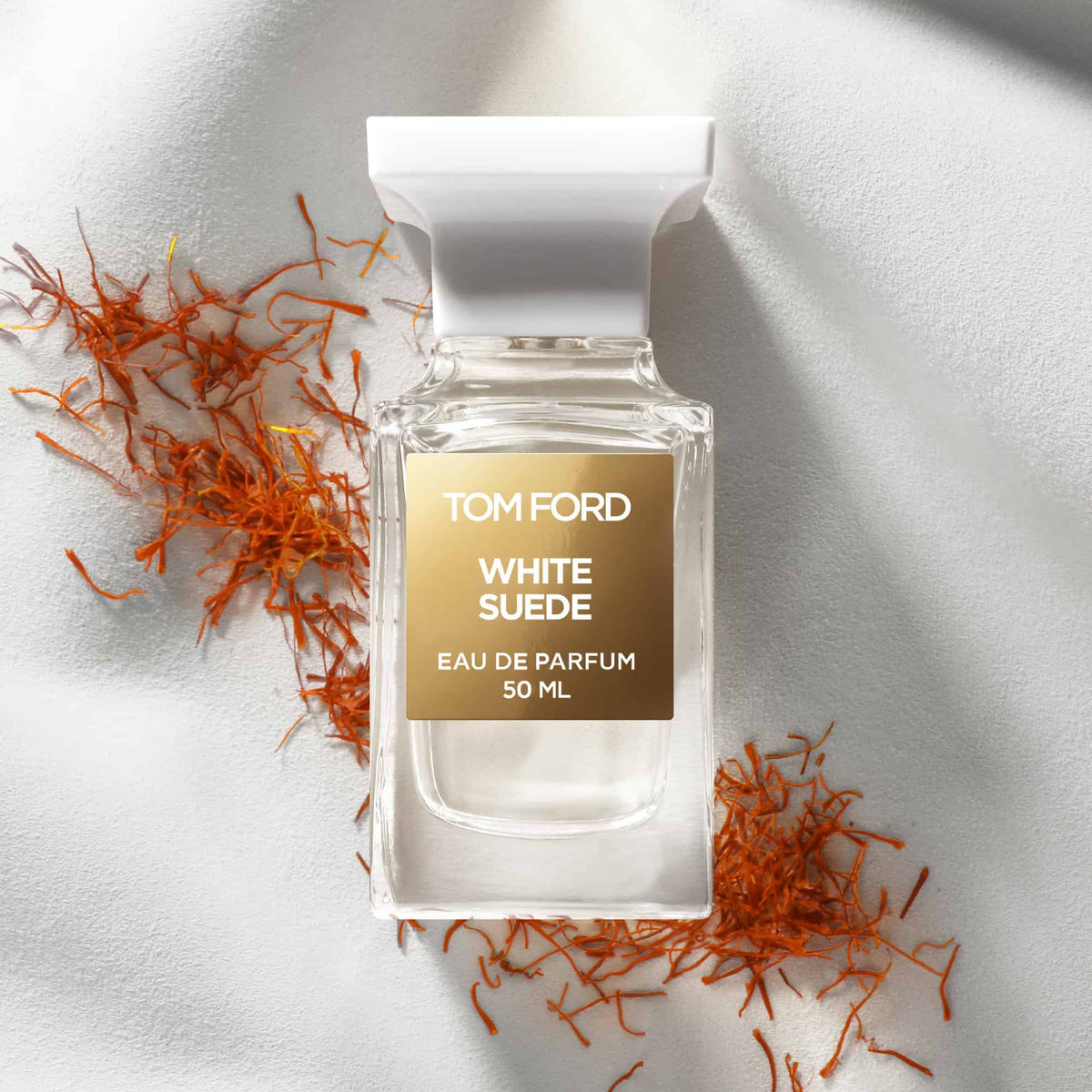 Tom Ford White Suede Eau de Parfum styled with saffron
