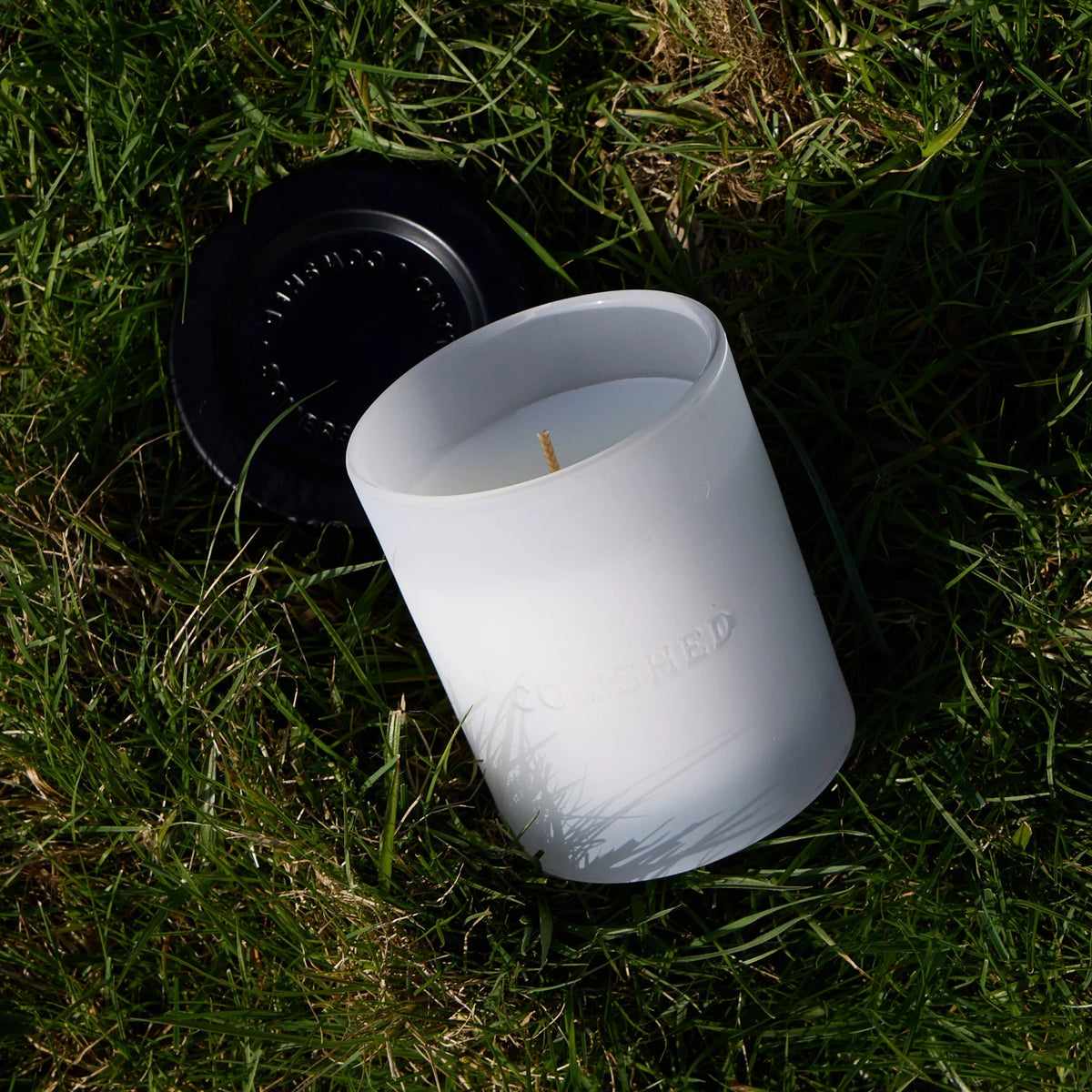 Cowshed Indulge Candle outdoor styled image