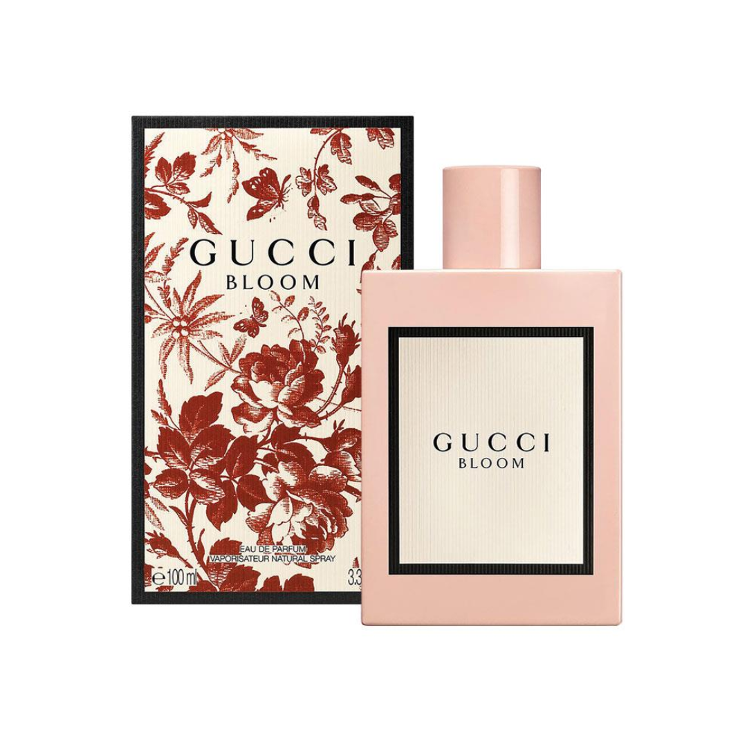 Gucci Bloom perfume bottle and packaging with floral design on a white background