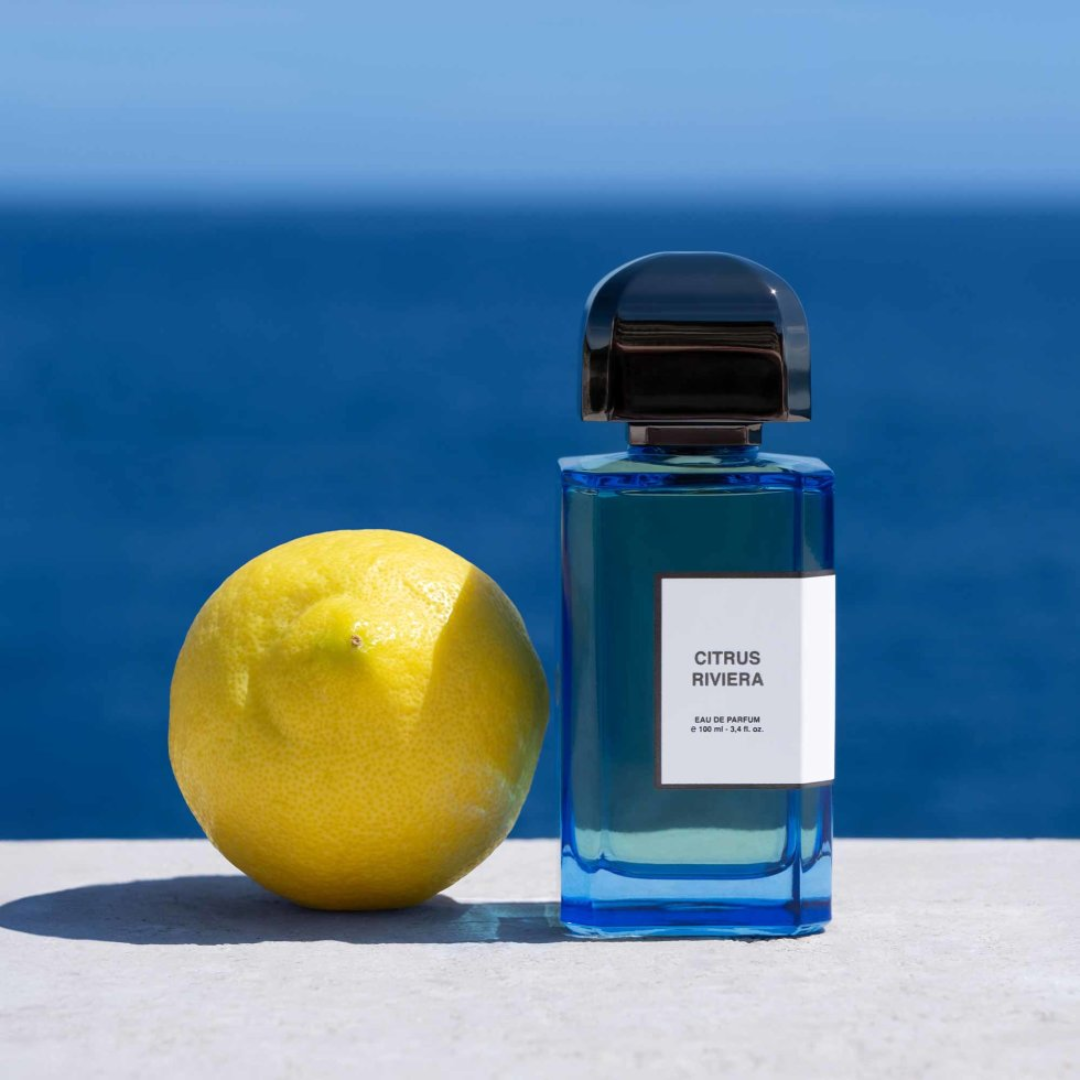 BDK Citrus Riviera Eau de Parfum styled with lemon and coastal summer background